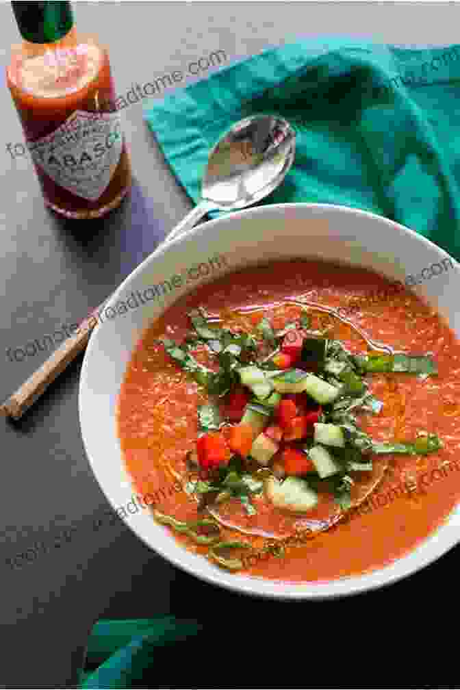 A Refreshing Bowl Of Gazpacho, Made With Ripe Tomatoes, Cucumbers, Garlic, And Olive Oil. European Cookbook Series: Spanish Famous Recipes