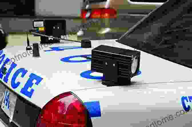 Law Enforcement Officer Using A License Plate Reader To Scan A Vehicle's License Plate. License Plate Readers For Law Enforcement: Opportunities And Obstacles