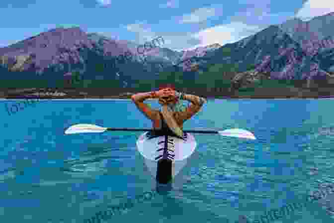 Woman Kayaking In A Serene Lake Surrounded By Mountains. Surviving Prostate Cancer: The Strength I Drew From My Kayak Adventures Daily Life S Humor And Gifted Doctors